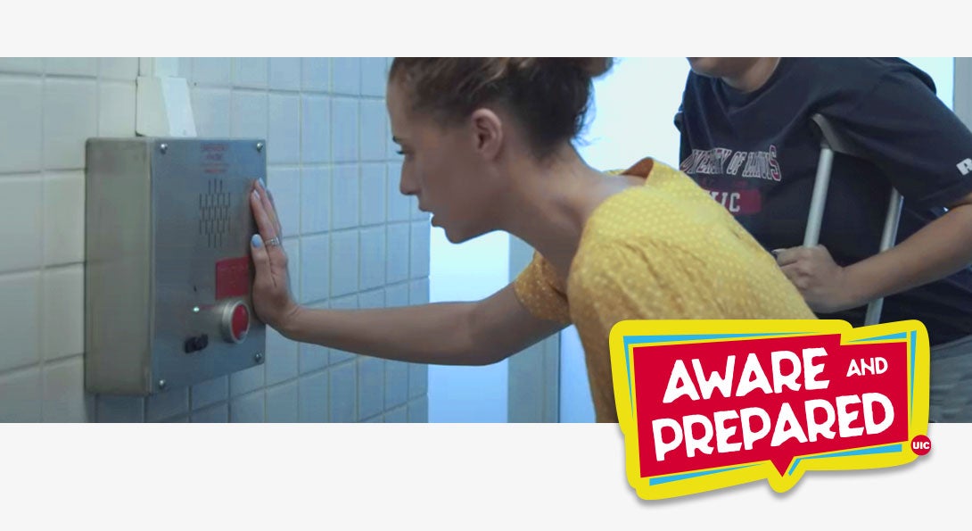 A female student is leaning over an emergency call box