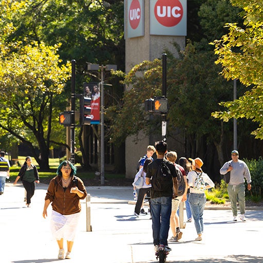 Several students walking across campus