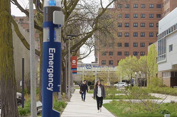 A close up to an Emergency Blue Light Pole outside of the Student Center West