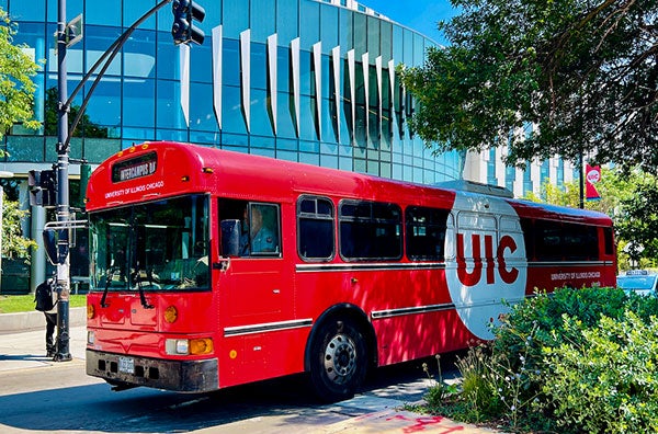 A UIC shuttle is driving in front of the ARC center