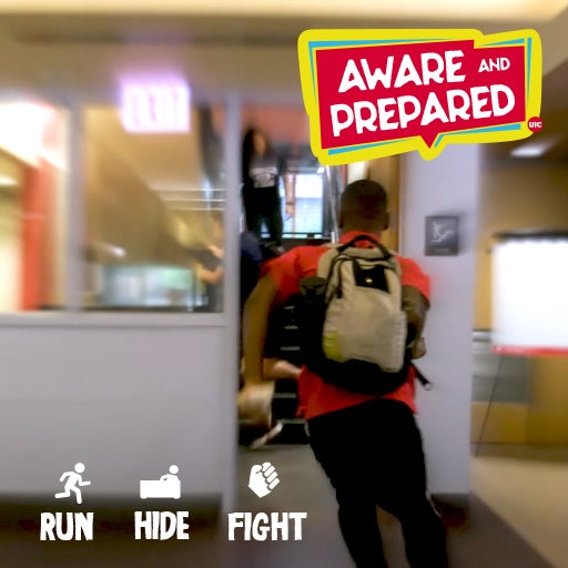 A student is running to the exit during a simulated active threat scenario. Aware and prepared. Run. Hide. Fight